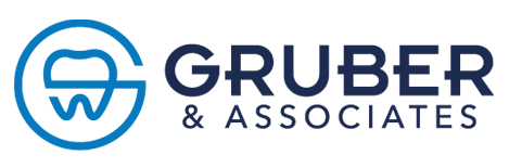 The image is a logo with text that reads  Gruber Associates  and includes a stylized letter  G  inside a circular emblem, set against a grey background.